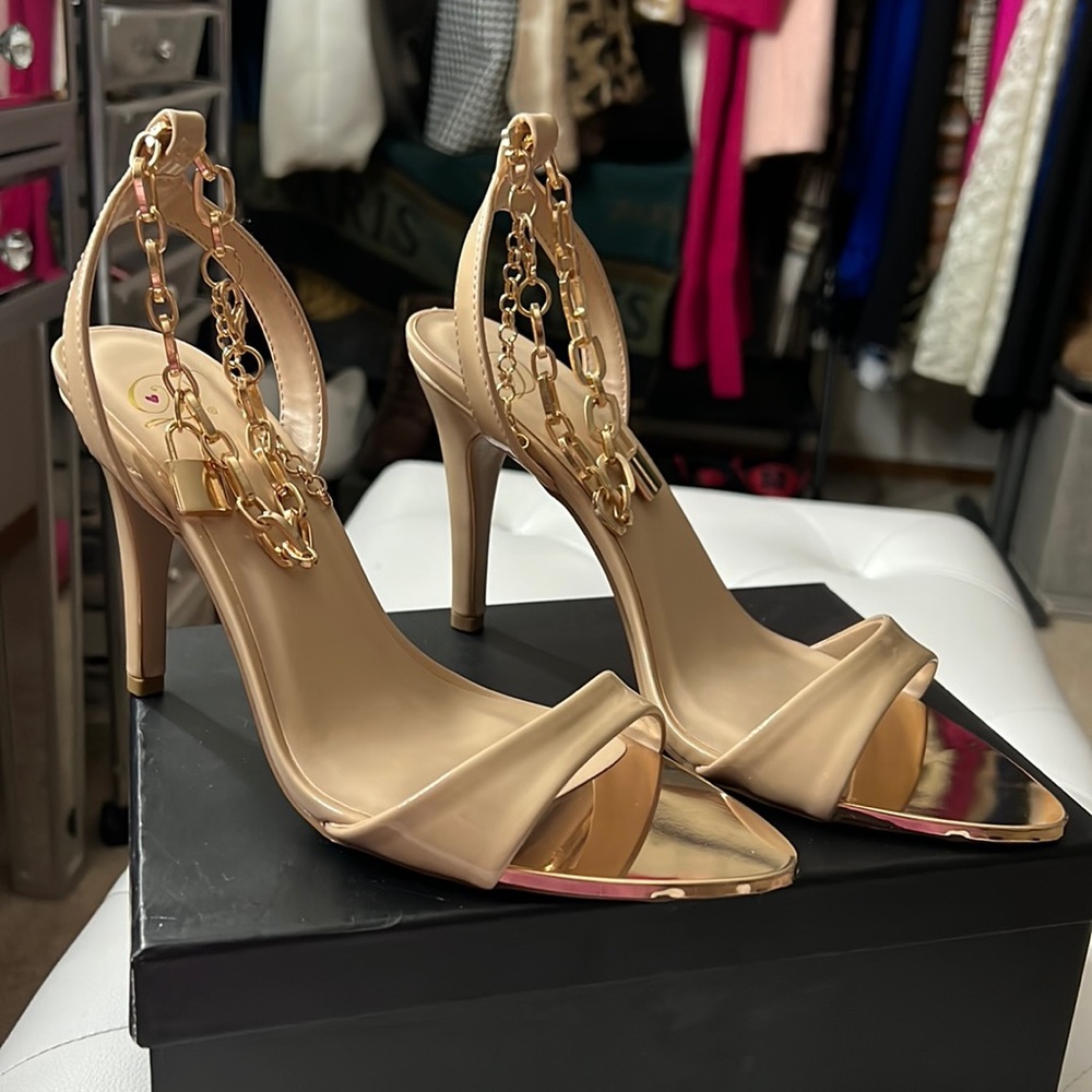 Gold heels with “Lock🔒” detail